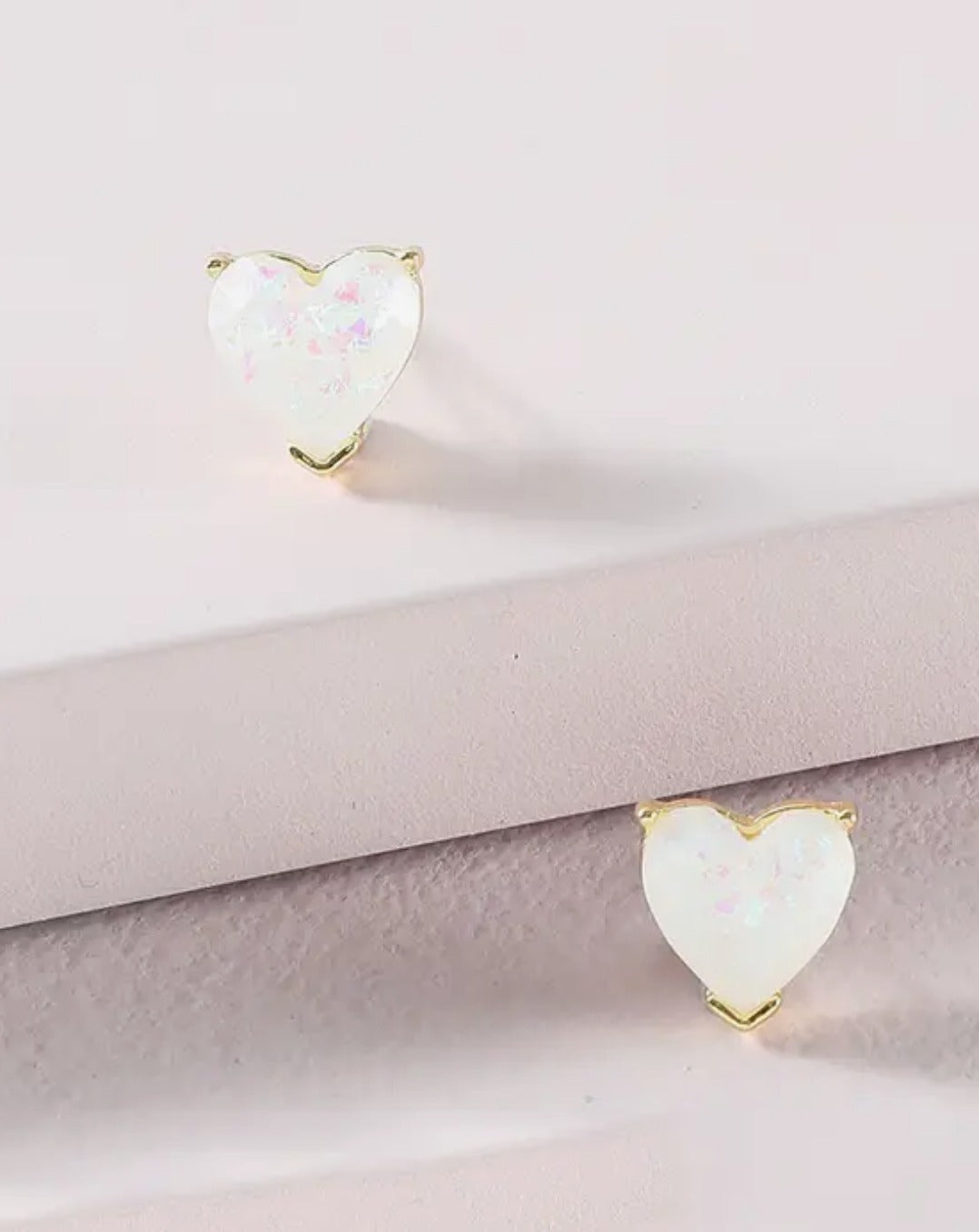 White heart in gold earring